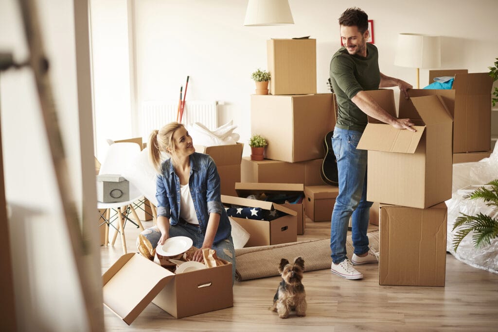 young couple packing items to move to storage in auckland